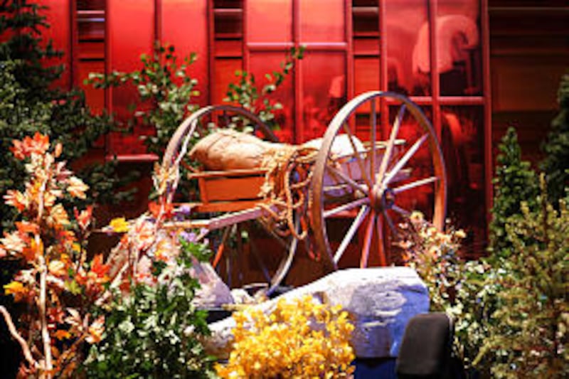 The Conference Center stage was decorated with an old-time radio, 1930s period furniture and a handc