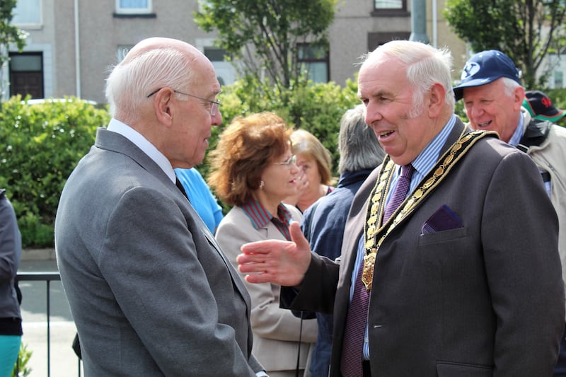 Dr. Ronald Dennis (left) speaks with the Chair of the Carmathenshire County Council, Councilor Mansel Charles, Plaid Cymru of Llanegwad, following the Island Place Meeting House plaque unveiling on Aug. 25, in Llanelli, Wales.