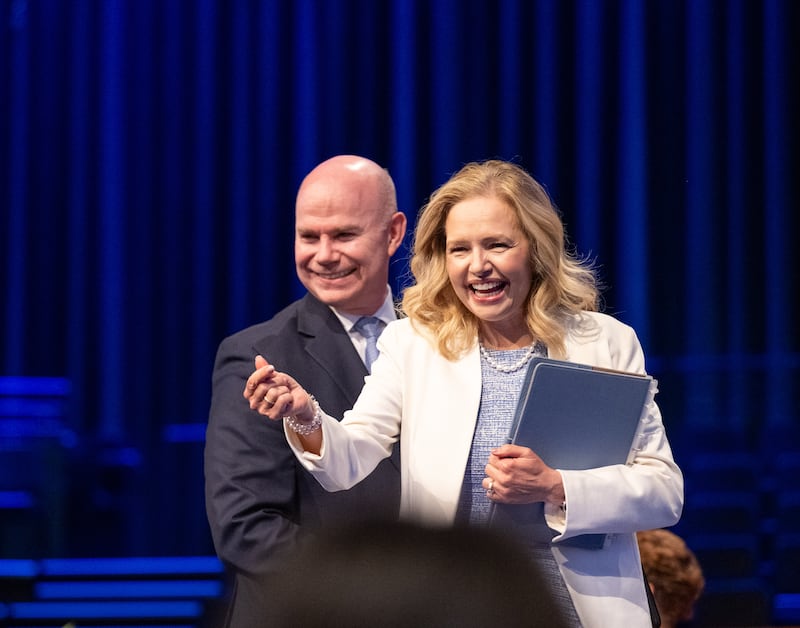 Brigham Young University–Idaho President Alvin F. Meredith III and his wife, Sister Jennifer Meredith, greet students at a campus devotional on Tuesday, April 21, 2026, in Rexburg, Idaho.