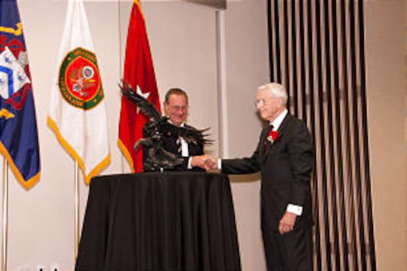 John Dillingham, left, presents community service award to to retired U.S. Army Lt. Gen. Robert Arte