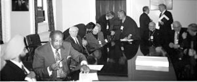 President Gordon B. Hinckley, third from left, is seated with leaders of diverse religious faiths be
