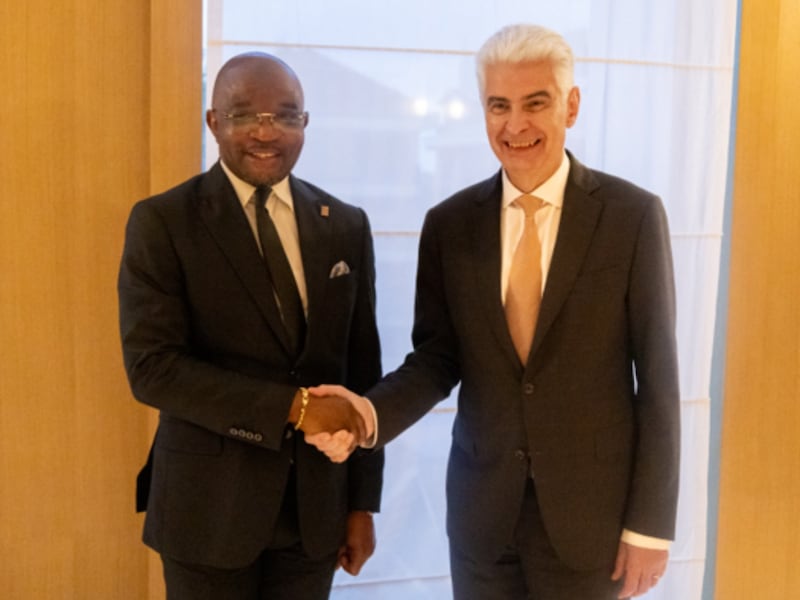 Elder Gérald Caussé shakes hands with a DRC government minister in Nairobi, Kenya, on Oct. 16, 2026.