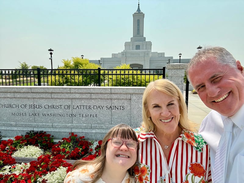 From left to right: Taylor, Leslie and Corbin Moberg take a selfie outside the Moses Lake Washington Temple in Moses Lake, Washington, on July 22, 2026.