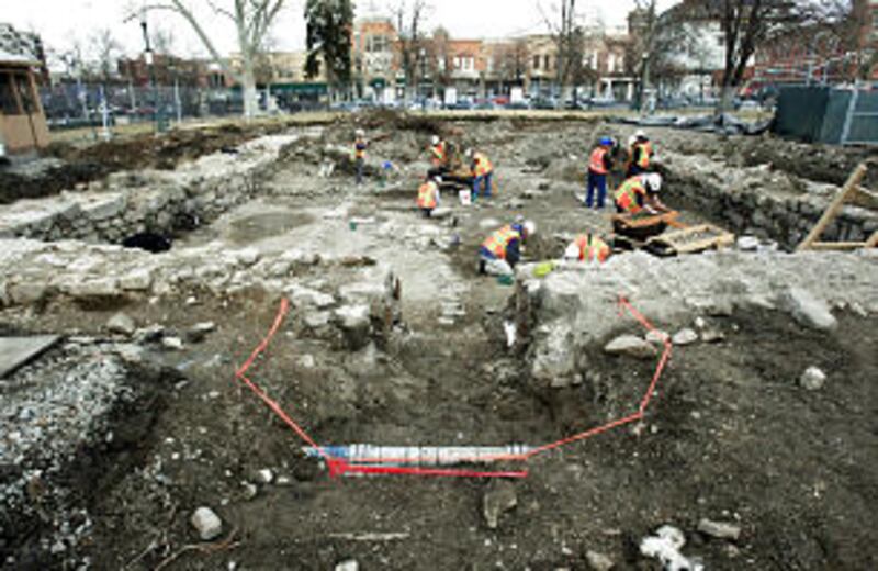 Workers uncover the original foundation for Provo's first tabernacle, a building known as the "old m