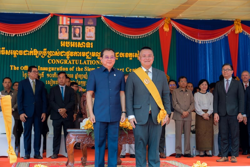 Chheang Ra and Elder Tai are acknowledged by the large crowd gathered to celebrate the opening of the heart center at the Siem Reap Provincial Referral Hospital.
