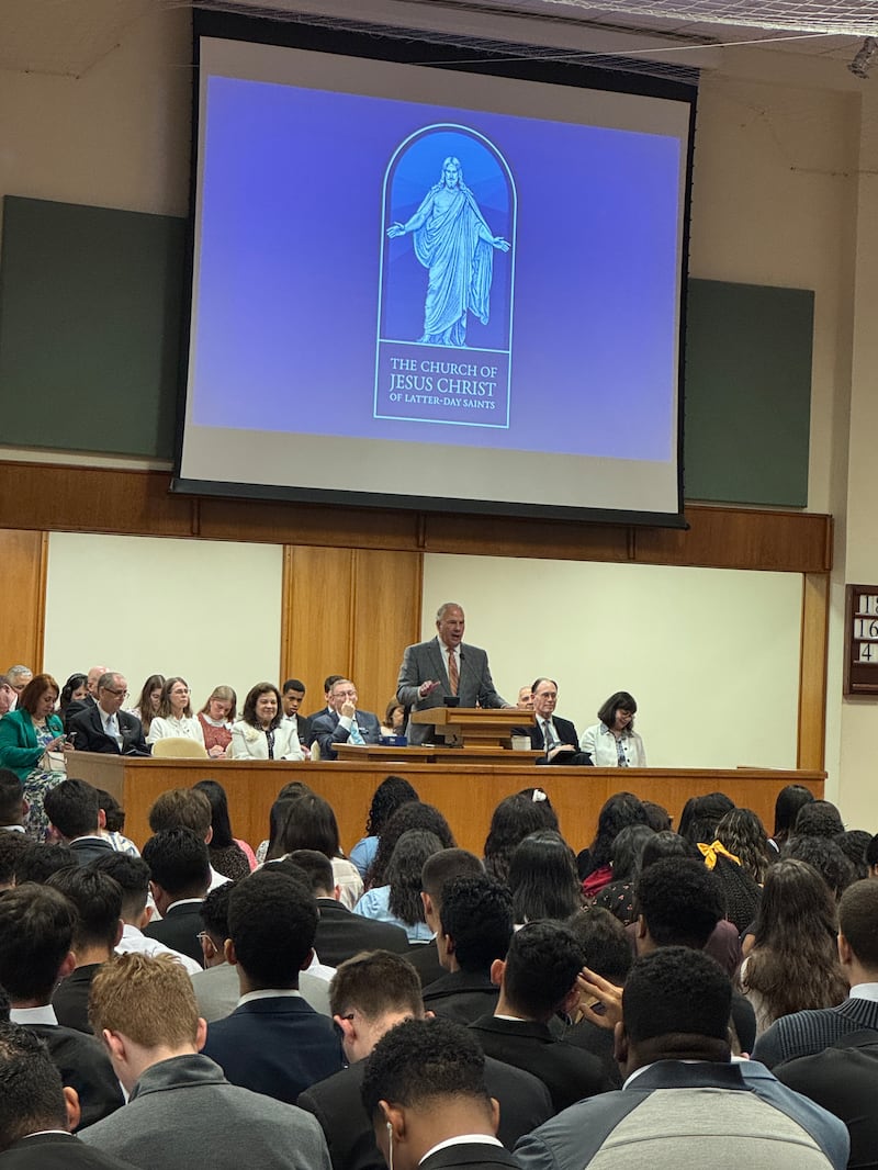 Elder Ronald A. Rasband speaks to missionaries at a devotional.