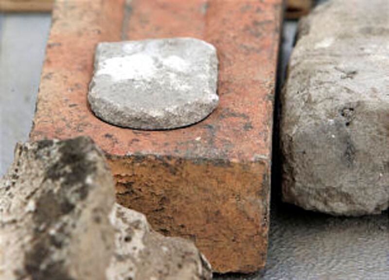 Small items found in the dig. Workers uncover the original Provo Tabernacle foundation Thursday, Feb