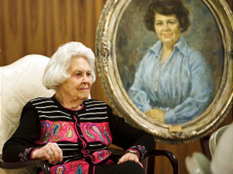 At a luncheon on Nov. 19 where she was honored for her Church service, Ruth Funk sits next to a port