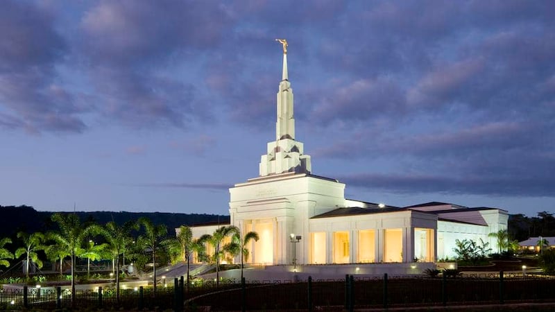 The Apia Samoa Temple after sunset.