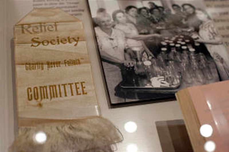 A Relief Society committee ribbon from the 1800s and a photograph from a Relief Society welfare proj