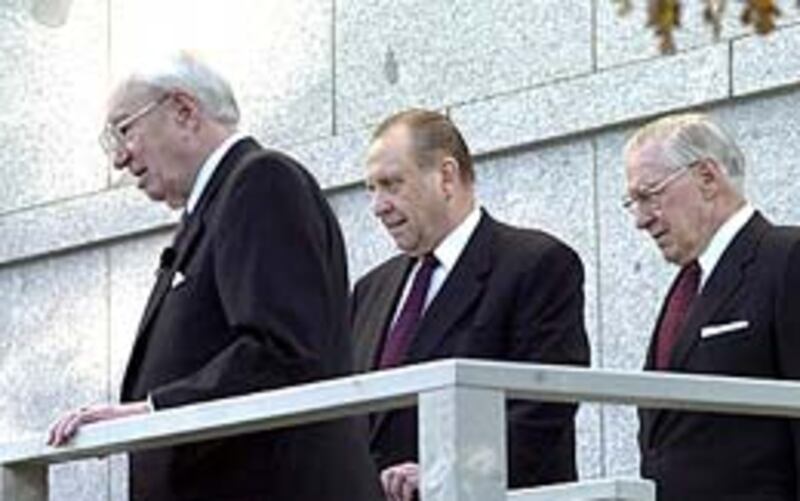 President Gordon B. Hinckley and his counselors, Presidents Thomas S. Monson and James E. Faust gath