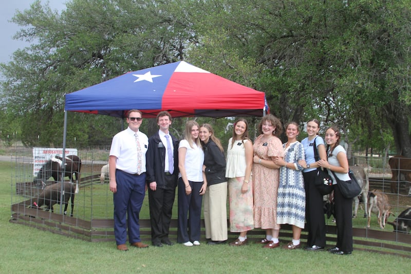 Missionaries pose outside of the "Fiesta 2026" in San Antonio, Texas, on April 11, 2026. Missionaries assisted in parking, serving food and welcoming guest to the event.