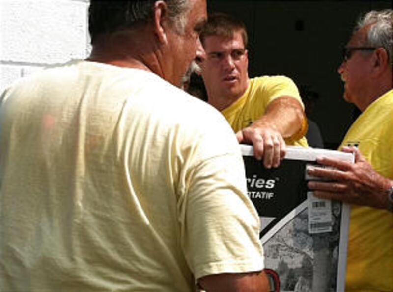 Members of the Harkers Island Ward, Kinston North Carolina Stake deliver supplies provided by the At