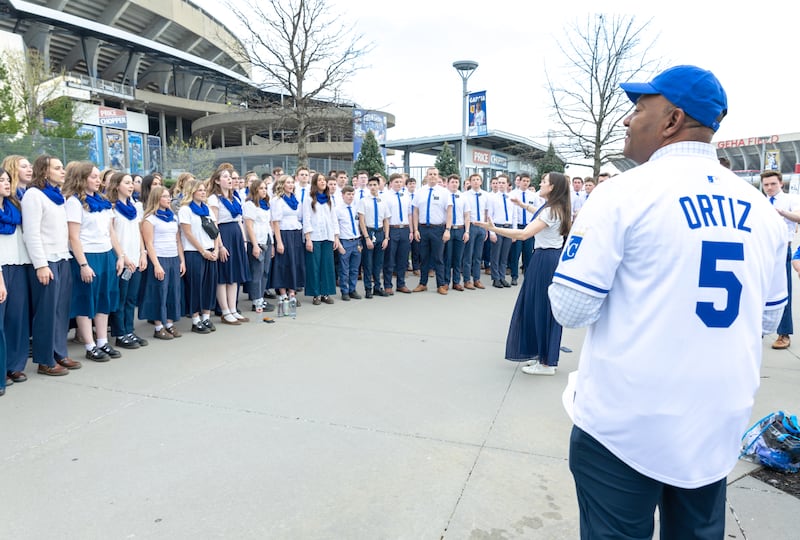 Elder G. Michael Ortiz, Area Seventy, hears missionaries in the Missouri Independence Mission warm up before the Kansas City Royals game in Kansas City, Missouri, Thursday, April 9, 2026.