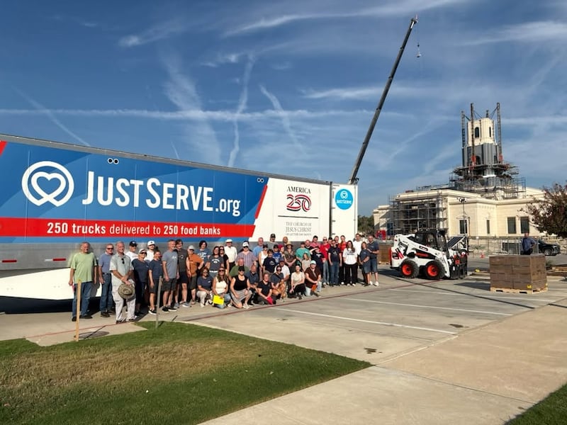 Latter-day Saint volunteers pose for a photo outside the under-construction Austin Texas Temple as they unload 40,000 pounds of food donated by the Church to go to local food pantries in Cedar Park, Texas, on Wednesday, Sept. 23, 2026.