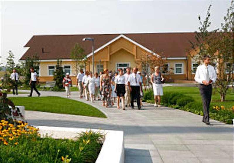 A tour group moves from the neighboring meetinghouse to the Kyiv Ukraine Temple during open house. M