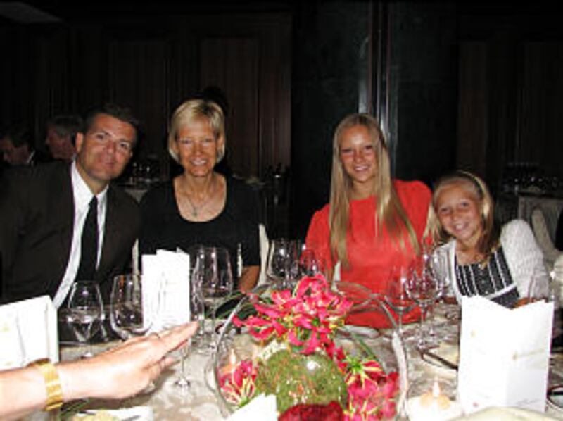 Antje Harvey sits with her husband, Ian, and daughters Hazel and Pearl during the German Sports Hall