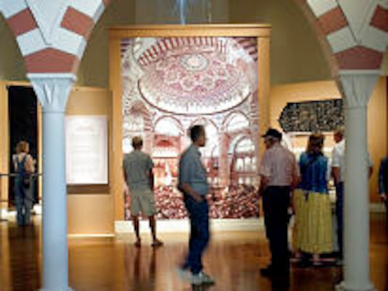 People take self guided audio tours at the Empire of the Sultans Exhibit at the BYU Museum of Art.