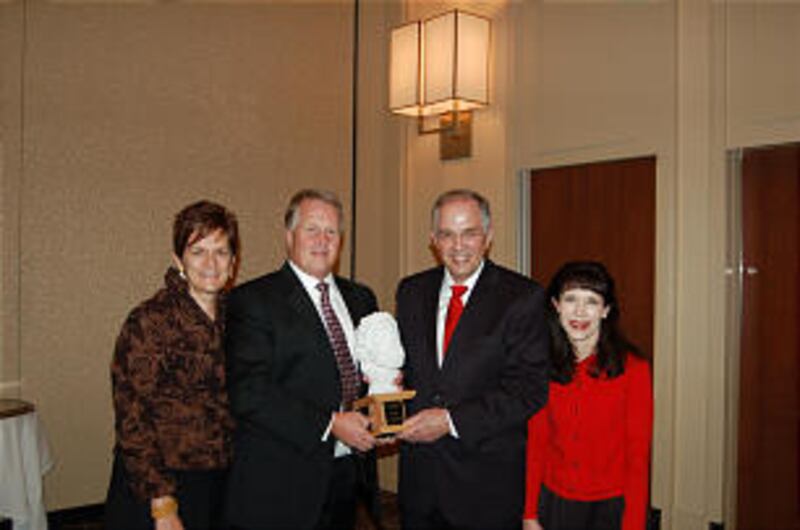 Elder Neil L. Andersen, center right, and his wife, Sister Kathy Andersen, right, pose with the Huma