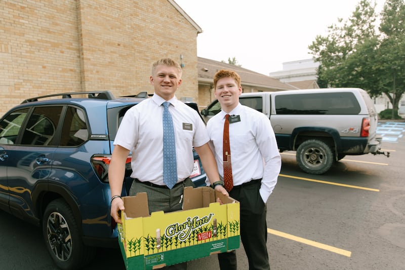 Missionaries in the Washington Spokane Mission bring food into the stake center for people affected by the wildfires in Spokane, Washington, on Aug. 2, 2026.