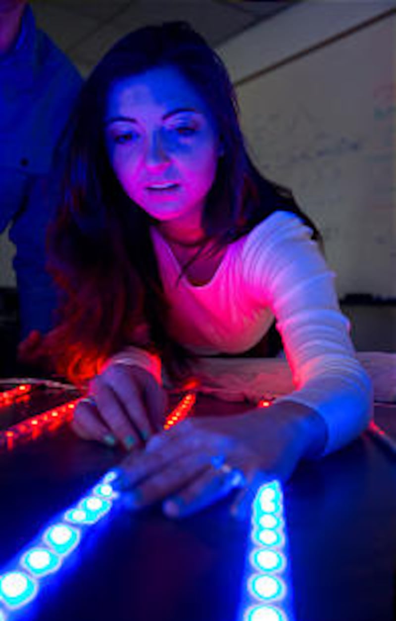 Specially made LED light dresses stand out during the BYU ballroom dance team's performance — done