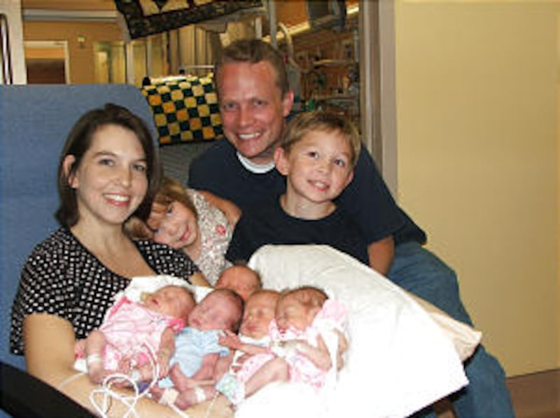 Jayson and Rachelle Wilkinson of the Austin Texas Stake gather their children for a family photo at