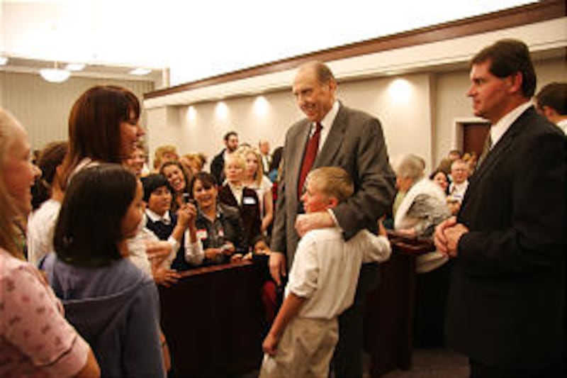 President Thomas S. Monson embraces Robert Wray, 10, at reunion of Sixth-Seventh Ward held Feb. 22,