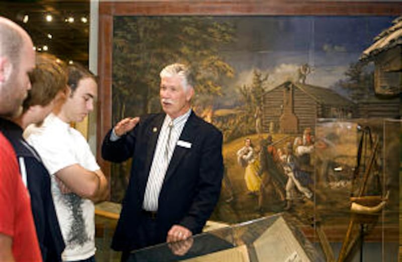 Docent Joe Brandon, right, gives a tour of the museum to Nigel Miner, Scott Hannah and Bryan Nichols