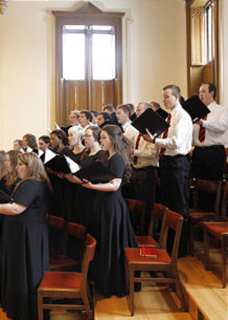 A choir from LDS Business College performs "Come Thou Fount of Every Blessing" before Elder Paul V.