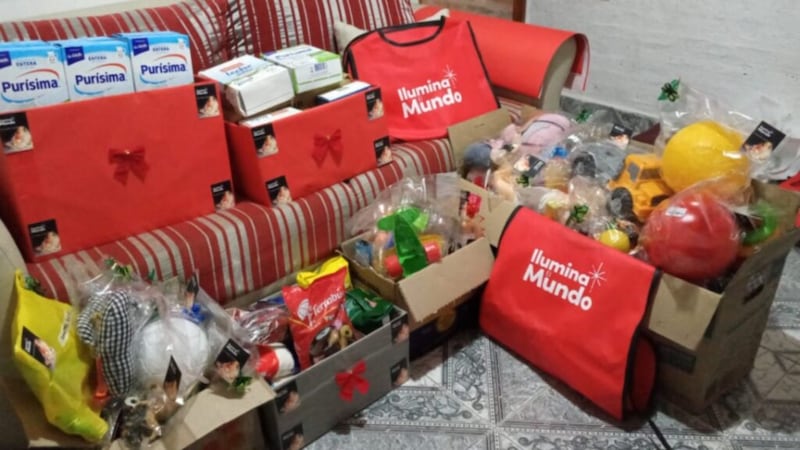 A view of #LightTheWorld food donations in boxes sit ready to be distributed to Huellitas de Amor (“prints of love,” in English) a food cafeteria for kids in Puerto Vilelas, Argentina, in December 2020.