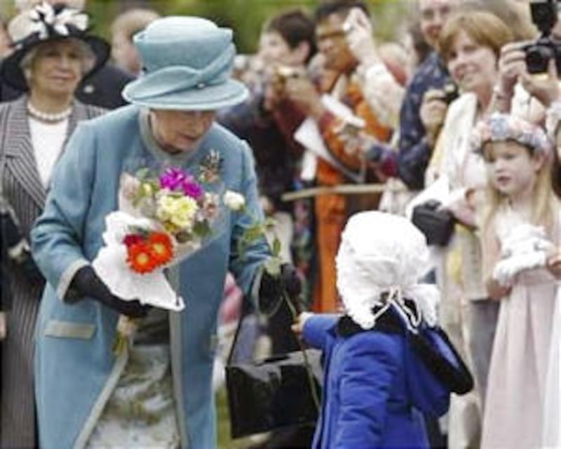 Meagan Hoag of the Jamestown Ward gives white rose to Queen Elizabeth II.