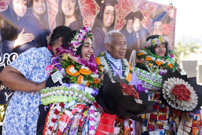 BYU–Hawaii graduates celebrate with family and friends outside the Cannon Activities Center in Laie, Hawaii, following commencement on Friday, Dec. 12, 2025.