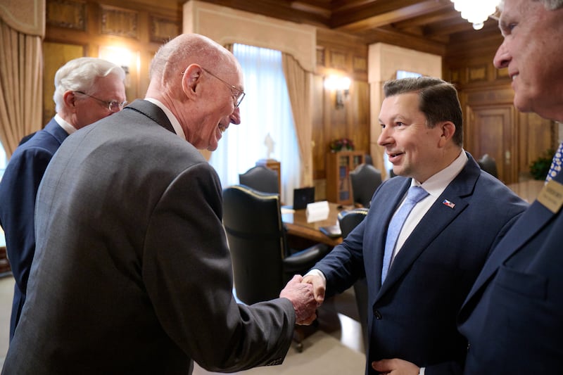President Henry B. Eyring, first counselor in the First Presidency, greets Miloslav Stašek, ambassador of the Czech Republic to the United States, during a visit.
