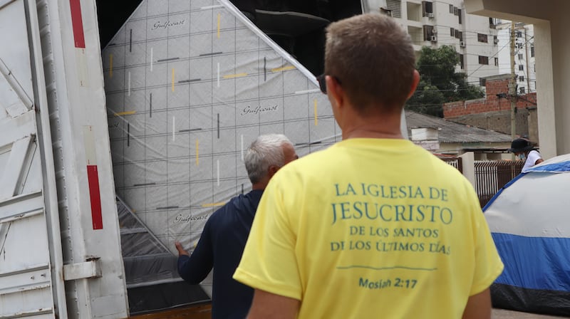 Volunteers from The Church of Jesus Christ of Latter-day Saints offload mattresses at a meetinghouse in La Guaira, Venezuela, on Saturday, July 4, 2026.