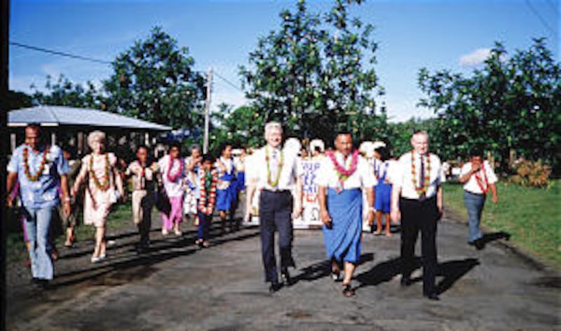 In 1988, President James E. Faust, right, walks in parade in Samoa with Elder John Sonneberg, then o