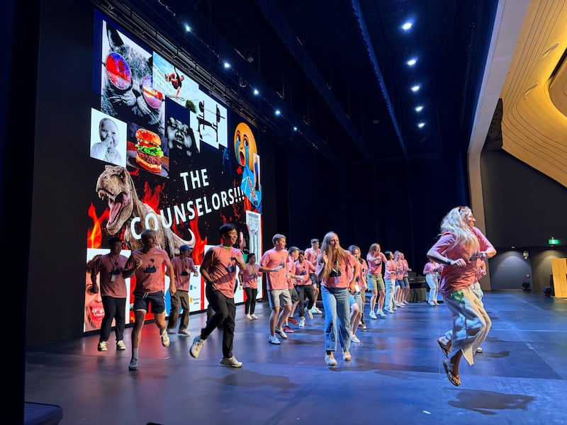 Counselors at an international For the Strength of Youth Conference dance on stage in front of the youth in Bangkok, Thailand, on June 18, 2026.