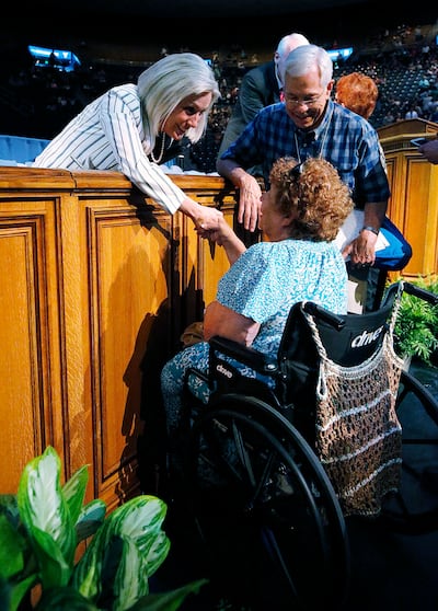 Sister Joy D. Jones, Primary general president of The Church of Jesus Christ of Latter-day Saints, greets Kay Gerken of Long Beach, California and Daniel Bartholomew of Orem after speaking during BYU Education Week in Provo on Tuesday, Aug. 21, 2018.