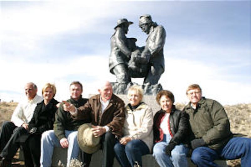 Posing with Martin's Cove statue are, from left, Leo and Annette Beus, Greg McNeil, Rusty and Donett