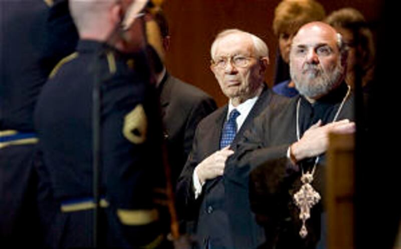 President Gordon B. Hinckley, left, and Father Michael A. Kouremetis stand for the posting of the co