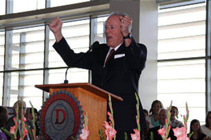 Dixie State University President Stephen Nadauld says, "Horray!" after President Dieter F. Uchtdorf