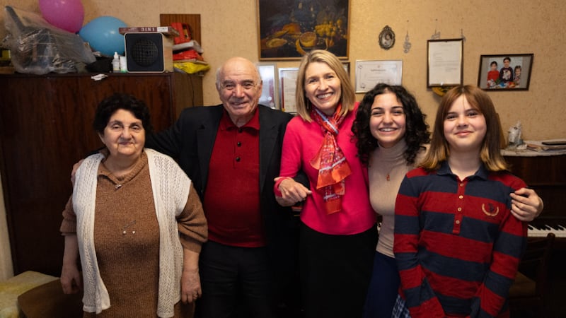 President Camille N. Johnson stands with two grandparents and their two granddaughters in Tbilisi, Georgia, on Wednesday, March 4, 2026.