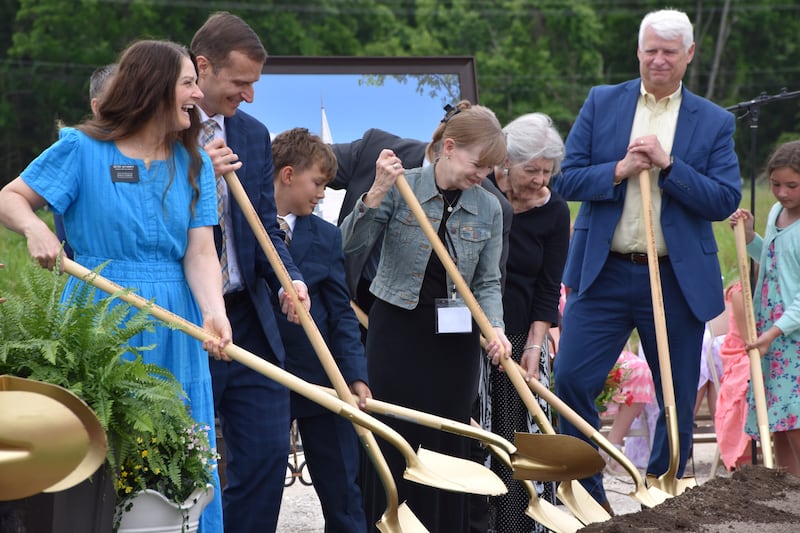 Latter-day Saints and community members participate in the turning of the soil at the groundbreaking of the Springfield Missouri Temple.