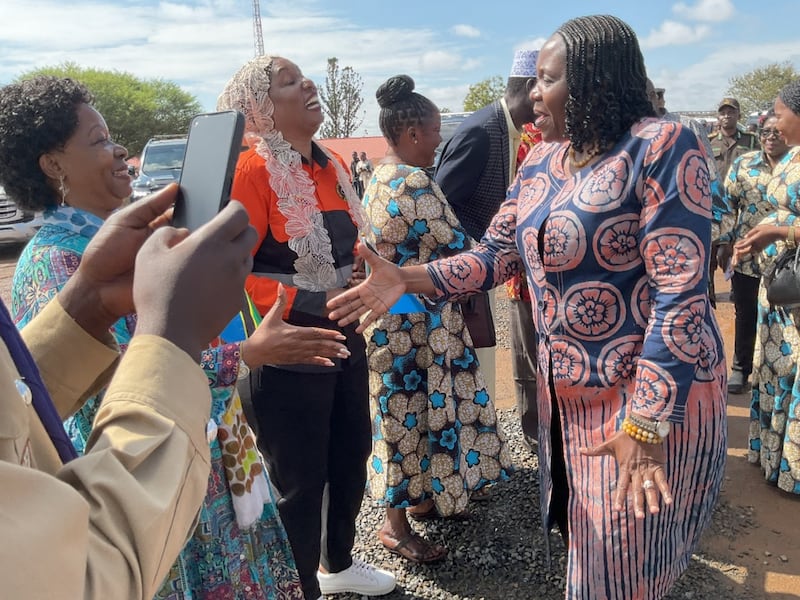 Dorothy Gwajima shakes hands with Judith Irungu Mhina Spendi when she arrives at the Kilangalala grounds in Geita, Tanzania to officiate in the International Women’s Day celebration on March 8, 2026.