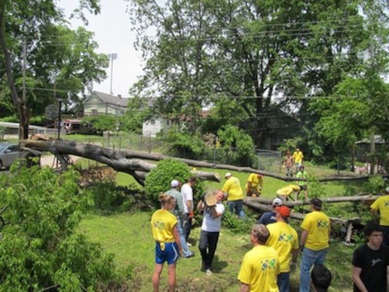 Volunteers work in Ms. Collins' yard.