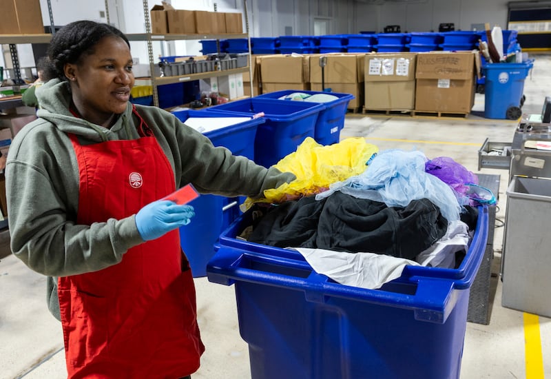 Zipporah Markus sorts clothing at the Humanitarian Center of The Church of Jesus Christ of Latter-day Saints in Salt Lake City, Utah, on Tuesday, May 19, 2026.