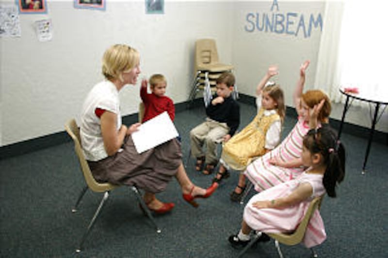 Sunset Ward Primary children are eager to answer question in teacher Lanie Wilkenson's class.