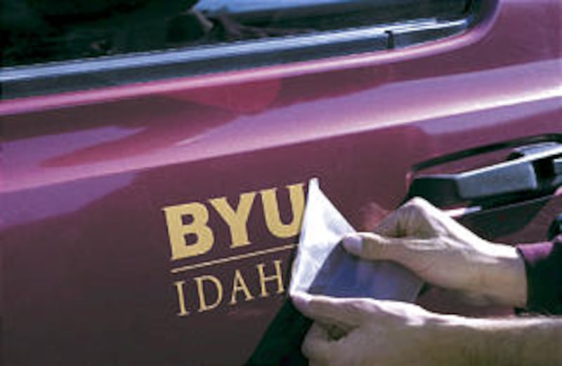 A first look at new name of college, BYU-Idaho, is seen stenciled on vehicle.