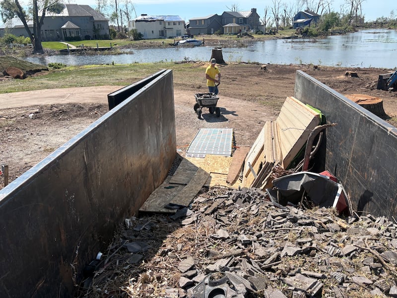 A volunteer in northeastern Wisconsin helps clear debris in the aftermath of an EF-3 tornado that touched down on July 27, 2026.