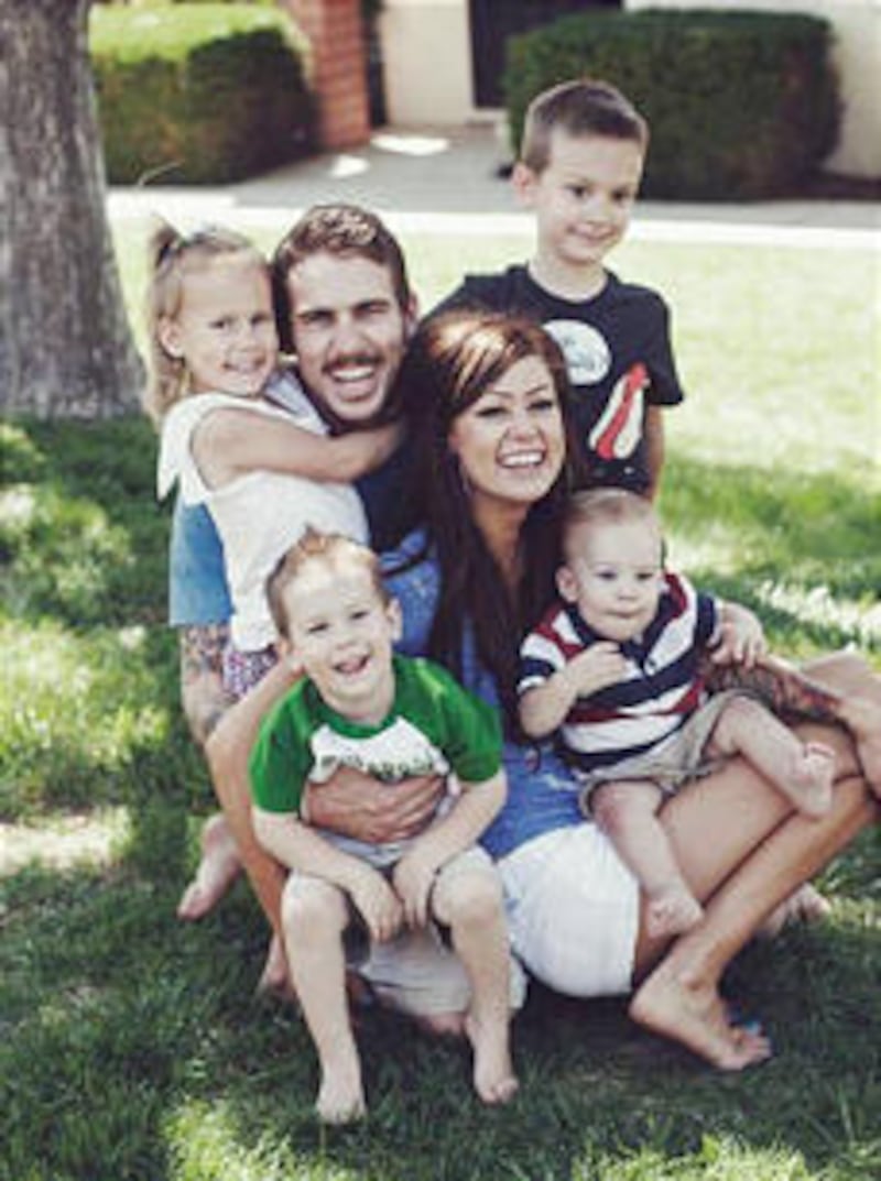 Andrew Ashcraft pictured with his wife and children.
