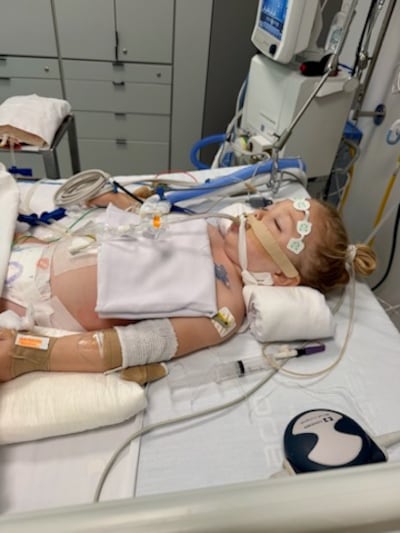 Estelle Santiago, then 3 years old, lies comatose in a hospital in Uruguay in January 2026.